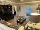 Bright living room with hardwood floors, comfy sofas, and access to a balcony at 601 N Hillside Dr. # 4235, North Myrtle Beach, SC 29582