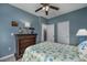 Bedroom with a queen bed, dresser, and light blue walls at 608 Surfsong Way # 608, North Myrtle Beach, SC 29582