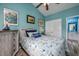 Guest bedroom with coastal decor, a queen bed, and access to a full bath at 608 Surfsong Way # 608, North Myrtle Beach, SC 29582