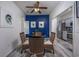 Bright dining area with a view into the kitchen and blue accent wall at 608 Surfsong Way # 608, North Myrtle Beach, SC 29582