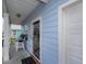 House exterior showcasing light blue siding, a porch, and attached garage at 608 Surfsong Way # 608, North Myrtle Beach, SC 29582