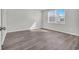 Spacious bedroom featuring vinyl plank flooring and a large window at 708 Canton St., Conway, SC 29526