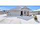 Snow covered home's exterior features a garage and front porch at 708 Canton St., Conway, SC 29526