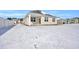 Back of house, snow-covered yard with footprints at 708 Canton St., Conway, SC 29526