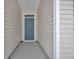 Front entry with gray door and light beige siding at 708 Canton St., Conway, SC 29526