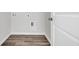 Laundry room with vinyl flooring and built-in shelving at 708 Canton St., Conway, SC 29526