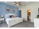 Spacious primary bedroom with king-size bed and en-suite bathroom at 713 N Ocean Blvd. # 204, Surfside Beach, SC 29575