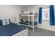 Bedroom with twin-over-twin bunk bed and full bed at 713 N Ocean Blvd. # 204, Surfside Beach, SC 29575