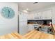 Well-equipped kitchen with white cabinets and butcher block countertops at 713 N Ocean Blvd. # 204, Surfside Beach, SC 29575