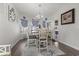 Bright dining area with table and chairs, hardwood floors, and access to a patio at 901 Queensferry Ct., Conway, SC 29526