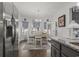Dining room featuring white table and chairs with accents of blue throughout the room and stainless steel refrigerator at 901 Queensferry Ct., Conway, SC 29526