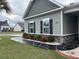 Beautiful home exterior with manicured landscaping and well-maintained lawn at 901 Queensferry Ct., Conway, SC 29526