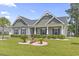 Charming single-story home boasts a welcoming porch and well-manicured lawn with decorative landscaping at 901 Queensferry Ct., Conway, SC 29526