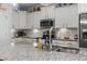 Bright kitchen with white cabinets, granite countertops, stainless steel appliances, and tile backsplash at 901 Queensferry Ct., Conway, SC 29526