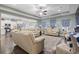 Spacious living room with leather couches and a view into the kitchen at 901 Queensferry Ct., Conway, SC 29526