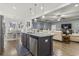 Spacious living area featuring a kitchen island, dining area, and a comfortable seating area at 901 Queensferry Ct., Conway, SC 29526