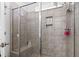 Modern shower with tile walls, a built-in bench, and recessed shelving for toiletries to create an at-home spa at 901 Queensferry Ct., Conway, SC 29526