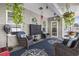 Inviting sunroom with comfortable seating, ceiling fan, and outdoor view at 901 Queensferry Ct., Conway, SC 29526