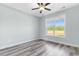 Bright bedroom with grey vinyl flooring and a large window at Tbd Hodges Rd., Conway, SC 29527