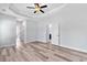 Main bedroom with tray ceiling, ceiling fan and wood-look flooring at Tbd Hodges Rd., Conway, SC 29527