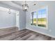 Bright dining room with large window and modern chandelier at Tbd Hodges Rd., Conway, SC 29527