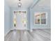 Light and airy entryway with white front door and grey vinyl flooring at Tbd Hodges Rd., Conway, SC 29527