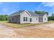 Rear view of a gray sided home with a patio at Tbd Hodges Rd., Conway, SC 29527