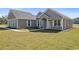 Gray sided home with white trim and landscaping at Tbd Hodges Rd., Conway, SC 29527