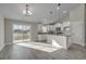 Eat-in kitchen with island, white cabinets, and hardwood floors at Tbd Hodges Rd., Conway, SC 29527