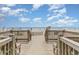 Wooden walkway to beach with benches and ocean view at 1207 S Ocean Blvd. # 20507, Myrtle Beach, SC 29577