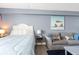 Studio bedroom with a comfortable bed and small living area at 1207 S Ocean Blvd. # 20507, Myrtle Beach, SC 29577