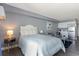 Studio bedroom with a comfortable bed and small living area at 1207 S Ocean Blvd. # 20507, Myrtle Beach, SC 29577
