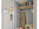 Small closet with shelving and an ironing board at 1207 S Ocean Blvd. # 20507, Myrtle Beach, SC 29577