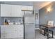 Small kitchen with white cabinets and modern appliances at 1207 S Ocean Blvd. # 20507, Myrtle Beach, SC 29577