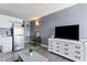 Studio living room with sofa, TV, and small kitchenette at 1207 S Ocean Blvd. # 20507, Myrtle Beach, SC 29577