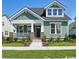 Charming green single-Gathering home with a well-manicured lawn and covered porch, capturing a cozy curb appeal at 1816 Tryon Dr, Myrtle Beach, SC 29588