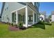 Covered patio with green lawn and manicured landscaping at 1816 Tryon Dr, Myrtle Beach, SC 29588
