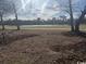 Backyard view overlooking a serene lake and trees at 1818 Topsail Ln., North Myrtle Beach, SC 29582