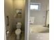 Bathroom featuring a toilet and a jetted tub at 1818 Topsail Ln., North Myrtle Beach, SC 29582