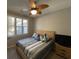 Bedroom featuring a large bed, ceiling fan, and TV at 1818 Topsail Ln., North Myrtle Beach, SC 29582