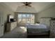 Primary bedroom with large windows and dresser at 1818 Topsail Ln., North Myrtle Beach, SC 29582