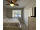 Bedroom with large window, ceiling fan, and double doors at 1818 Topsail Ln., North Myrtle Beach, SC 29582