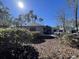 Gray house with a well-maintained lawn and landscaping at 1818 Topsail Ln., North Myrtle Beach, SC 29582