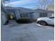 Gray house with attached garage and walkway at 1818 Topsail Ln., North Myrtle Beach, SC 29582