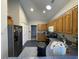 Kitchen with wood cabinets and black appliances at 1818 Topsail Ln., North Myrtle Beach, SC 29582