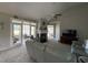 Open living room with a fireplace and view of a bedroom at 1818 Topsail Ln., North Myrtle Beach, SC 29582