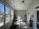 Sunroom with large windows, seating area, and collectibles at 1818 Topsail Ln., North Myrtle Beach, SC 29582
