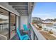 Private balcony with pool view and seating for two at 1890 Colony Dr. # 17-G, Surfside Beach, SC 29575