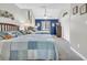 Main bedroom with a king bed, beach decor, and en-suite bathroom at 1890 Colony Dr. # 17-G, Surfside Beach, SC 29575