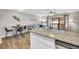 Kitchen with granite countertops and a view into the living room at 1890 Colony Dr. # 17-G, Surfside Beach, SC 29575
